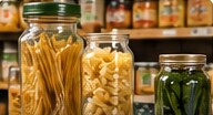 Illustrative pantry jars arranged on a shelf